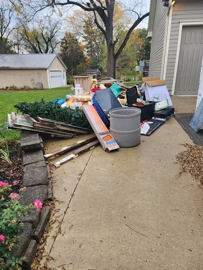 Dumpster being loaded with debris for Commercial Dumpster Rental in East Riverdale
